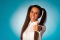 Beautiful hispanic business woman gesturing success shownig thumb up Royalty Free Stock Photo