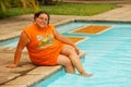 Beautiful Hispanic Woman by the pool