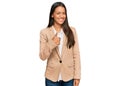 Beautiful hispanic woman wearing business jacket doing happy thumbs up gesture with hand Royalty Free Stock Photo