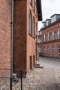 Beautiful historic brick buldings line a cobblestone street in Ribe Royalty Free Stock Photo