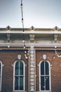 Beautiful historic building with old large windows, outdoor lights in a historic place of Denver city Royalty Free Stock Photo