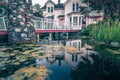 Beautiful historic home details and nature pond with reflection Royalty Free Stock Photo