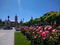 Beautiful gardens and monuments in the background in the city centre of Alcala de Henares, Madrid, Spain.