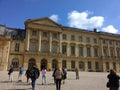 Beautiful historical buildings and tourists in the Chateaux de Versailles in paris in France Royalty Free Stock Photo