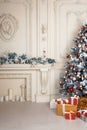 Beautiful holdiay decorated room with Christmas tree and presents under it. New Year decorations Royalty Free Stock Photo