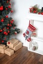 Beautiful holdiay decorated room with Christmas tree and presents under it. New Year decorations Royalty Free Stock Photo