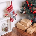 Beautiful holdiay decorated room with Christmas tree and presents under it. New Year decorations Royalty Free Stock Photo