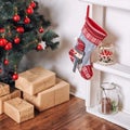 Beautiful holdiay decorated room with Christmas tree and presents under it. New Year decorations Royalty Free Stock Photo