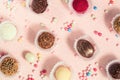 Beautiful holiday candies in a pearly dusting, chocolate and coconut round candies in wrappers top view, sugar cake decorations