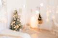 Beautiful holiday decorated room with Christmas tree and bright lights , out of focus shot for photo background. Blur christmas Royalty Free Stock Photo