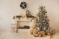 Beautiful holiday decorated room with Christmas tree with presents under it