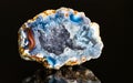 Beautiful hollow agate semi-precious stone with clear raw crystals inside geode Royalty Free Stock Photo