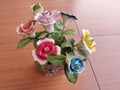 beautiful home accessories a flower replica made of ceramic (rose replica). brown floor as background