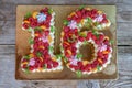 Homemade cake in the form of the number sixteen