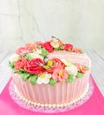 Beautiful homemade cake. Cake decorated with red and pink rose and flora with butterfly for birthday Royalty Free Stock Photo