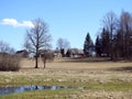 Beautiful homestead, trees and field, Lithuania Royalty Free Stock Photo