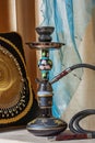 Beautiful hookah standing on a table in the eastern interior