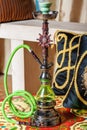 Beautiful hookah standing on a table in the eastern interior Royalty Free Stock Photo