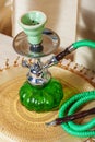 Beautiful hookah standing on a table in the eastern interior Royalty Free Stock Photo