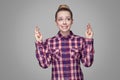 Beautiful hopeful blonde girl in red, pink checkered shirt, coll