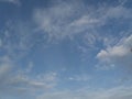 A beautiful horizontal shot of bright blue sky with puffy white clouds. Royalty Free Stock Photo