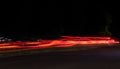 Beautiful horizontal timelapse shot of car lights at nighttime