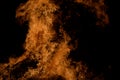 Beautiful hot burning tall flames from bonfire on dark winter Royalty Free Stock Photo
