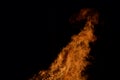 Beautiful hot burning tall flames from bonfire on dark winter background Royalty Free Stock Photo