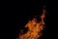 Beautiful hot burning tall flames from bonfire on dark winter background Royalty Free Stock Photo