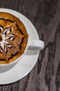 Beautiful mocha latte art foam coffee on wooden table Royalty Free Stock Photo