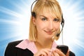 Beautiful hotline operator with cellphone in her h