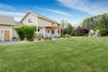 Beautiful house backyard with well kept lawn and patio area Royalty Free Stock Photo