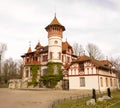 Beautiful House with a Big Tower by the Lake Royalty Free Stock Photo