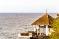 Beautiful House On The Edge Of A Cliff With Bottom A Recreational Boat On The Promenade On Las Americas Beach. April 11, 2019.