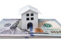 Beautiful house standing on dollar bills. Home expenses or investing concept Royalty Free Stock Photo