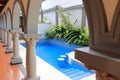 beautiful house swimming pool view from the veranda, summer day Royalty Free Stock Photo