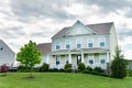 beautiful house with a well-kept and landscaped yard and lawn