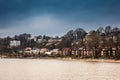 Beautiful houses and beaches on the banks of Elbe river in Hamburg on a cold end of winter day Royalty Free Stock Photo