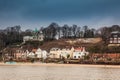 Beautiful houses and beaches on the banks of Elbe river in Hamburg on a cold end of winter day Royalty Free Stock Photo