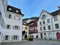 Beautiful houses in the old town of medieval Feldkirch with Schattenburg in the background. Vorarlberg, Austria.