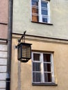 Beautiful houses in the old town in Warsaw. Old lantern. Royalty Free Stock Photo