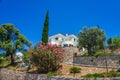 Beautiful houses overlooking the Aegean sea on the road to Megali Ammos beach in western Alonissos island, Greece, Europe