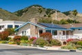 Beautiful houses with solar panels, with nicely landscaped front the yard, California Royalty Free Stock Photo