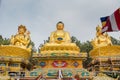 Beautiful huge golden color buddhist statues in the temple Royalty Free Stock Photo