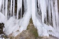 Beautiful and huge icicles in river cascade Royalty Free Stock Photo