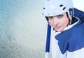 Beautiful ice hockey female player fashion portrait on the ice background