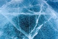 Beautiful ice of Lake Baikal with abstract cracks