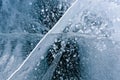 Beautiful ice of Lake Baikal with abstract cracks