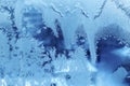 Beautiful ice pattern close-up on winter window glass Royalty Free Stock Photo