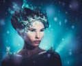Beautiful ice queen in a falling snow Royalty Free Stock Photo